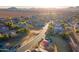 Aerial view of neighborhood with a park and playground in the foreground at 34403 N Damietta Trl, San Tan Valley, AZ 85143