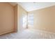 Spacious bedroom with window and neutral wall tones at 34403 N Damietta Trl, San Tan Valley, AZ 85143