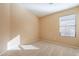 Well-lit bedroom with carpeted floor and window blinds at 34403 N Damietta Trl, San Tan Valley, AZ 85143