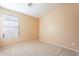 Bright bedroom featuring carpeted floor and window at 34403 N Damietta Trl, San Tan Valley, AZ 85143