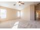 Large bedroom with vaulted ceiling and carpeted floor at 34403 N Damietta Trl, San Tan Valley, AZ 85143