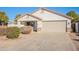 Single-story home with front yard landscaping and a two-car garage at 34403 N Damietta Trl, San Tan Valley, AZ 85143