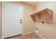 Laundry room with built-in shelving and exterior access at 34403 N Damietta Trl, San Tan Valley, AZ 85143