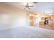 Spacious living room with vaulted ceiling and neutral carpet at 34403 N Damietta Trl, San Tan Valley, AZ 85143