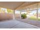 Covered patio with gravel flooring and artificial turf at 34403 N Damietta Trl, San Tan Valley, AZ 85143