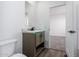 Clean bathroom with a vanity and toilet; view of another room at 36711 W Harrison St, Tonopah, AZ 85354