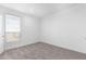 Bright bedroom with neutral wall and carpet flooring at 36711 W Harrison St, Tonopah, AZ 85354