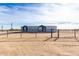 Single-story home with gray siding and a fenced yard at 36711 W Harrison St, Tonopah, AZ 85354