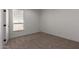 Bright bedroom with carpeted floor and large window at 36735 W Harrison St, Tonopah, AZ 85354