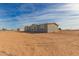 Grey manufactured home with desert landscape at 36735 W Harrison St, Tonopah, AZ 85354