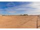 Large lot with desert landscape and fencing at 36735 W Harrison St, Tonopah, AZ 85354