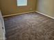 Spacious bedroom with plush carpet and window blinds at 36850 W Nola Way, Maricopa, AZ 85138