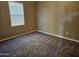 Well-lit bedroom with carpet flooring and window blinds at 36850 W Nola Way, Maricopa, AZ 85138