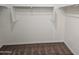 Large walk-in closet with double hanging rods and shelves at 36850 W Nola Way, Maricopa, AZ 85138