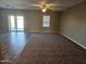 Spacious living room with vinyl plank flooring and carpet at 36850 W Nola Way, Maricopa, AZ 85138