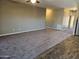 Living room with carpeted floor and neutral wall colors at 36850 W Nola Way, Maricopa, AZ 85138