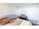 Well-lit bedroom with a double bed and vintage dresser at 3750 W Marshall Ave, Phoenix, AZ 85019