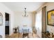 Small dining area with a round table and chandelier at 3750 W Marshall Ave, Phoenix, AZ 85019