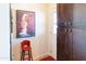 Charming kitchen features dark wood cabinetry and a red barstool at 3750 W Marshall Ave, Phoenix, AZ 85019