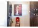 Laundry area with stacked washer and dryer, and a red stool at 3750 W Marshall Ave, Phoenix, AZ 85019