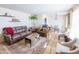 Spacious living room featuring leather sofas and a dining area at 3750 W Marshall Ave, Phoenix, AZ 85019