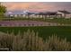 Outdoor basketball court and covered seating area with manicured lawns create recreational opportunities for residents at 3752 W Antelope Way, San Tan Valley, AZ 85144