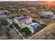 Aerial view showcasing a house with solar panels, pool, and desert landscape at 3756 E Galvin St, Cave Creek, AZ 85331