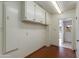 Laundry room with ample storage cabinets at 3809 E Highland Ave, Phoenix, AZ 85018