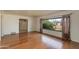 Spacious living room featuring hardwood floors and large windows at 3809 E Highland Ave, Phoenix, AZ 85018