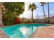 Relaxing kidney shaped pool with brick patio at 3809 E Highland Ave, Phoenix, AZ 85018