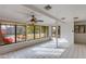 Sunroom with tile floors and view of the backyard pool at 3809 E Highland Ave, Phoenix, AZ 85018