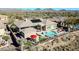 Backyard oasis with a large pool and spa, plus a covered patio area. Solar panels visible at 40610 N Bradon Ct, Phoenix, AZ 85086