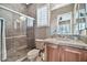 Bathroom with a walk-in shower and wood cabinets at 40610 N Bradon Ct, Phoenix, AZ 85086