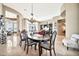 Elegant dining room featuring a large table and chandelier at 40610 N Bradon Ct, Phoenix, AZ 85086