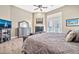 Main bedroom with wood floors, built-in fireplace, and ample natural light at 40610 N Bradon Ct, Phoenix, AZ 85086