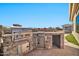 Built-in outdoor kitchen with stainless steel appliances at 40610 N Bradon Ct, Phoenix, AZ 85086