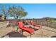 Spacious patio with fire pit and comfortable lounge chairs at 40610 N Bradon Ct, Phoenix, AZ 85086