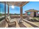 Relaxing patio furniture with a view of the pool and landscape at 40610 N Bradon Ct, Phoenix, AZ 85086