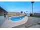 Inviting kidney-shaped pool with grassy backyard and privacy wall at 413 W Marco Polo Rd, Phoenix, AZ 85027