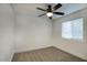 Spacious bedroom featuring new carpet and ceiling fan at 413 W Marco Polo Rd, Phoenix, AZ 85027