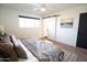 Spacious bedroom featuring a sliding barn door and large window at 4525 N 82Nd St, Scottsdale, AZ 85251