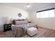 Spacious bedroom with king-size bed and large windows at 4525 N 82Nd St, Scottsdale, AZ 85251