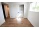 Simple bedroom with light wood floors and a large closet at 4525 N 82Nd St, Scottsdale, AZ 85251