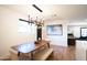 Modern dining area featuring a wood table and stylish chandelier at 4525 N 82Nd St, Scottsdale, AZ 85251