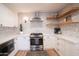 Modern kitchen with white cabinets, stainless steel appliances, and a subway tile backsplash at 4525 N 82Nd St, Scottsdale, AZ 85251