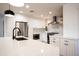 Modern kitchen with white shaker cabinets, stainless steel appliances, and large island at 4525 N 82Nd St, Scottsdale, AZ 85251