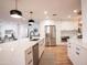 Modern kitchen with white cabinets, stainless steel appliances & quartz countertops at 4525 N 82Nd St, Scottsdale, AZ 85251