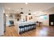 Modern kitchen with white cabinets, a large island, and stainless steel appliances at 4525 N 82Nd St, Scottsdale, AZ 85251