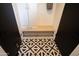 Laundry room with built-in storage and tile floor at 4525 N 82Nd St, Scottsdale, AZ 85251