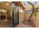 Private courtyard entry with wrought-iron gate and brick pavers at 4540 N 44Th St # 69, Phoenix, AZ 85018